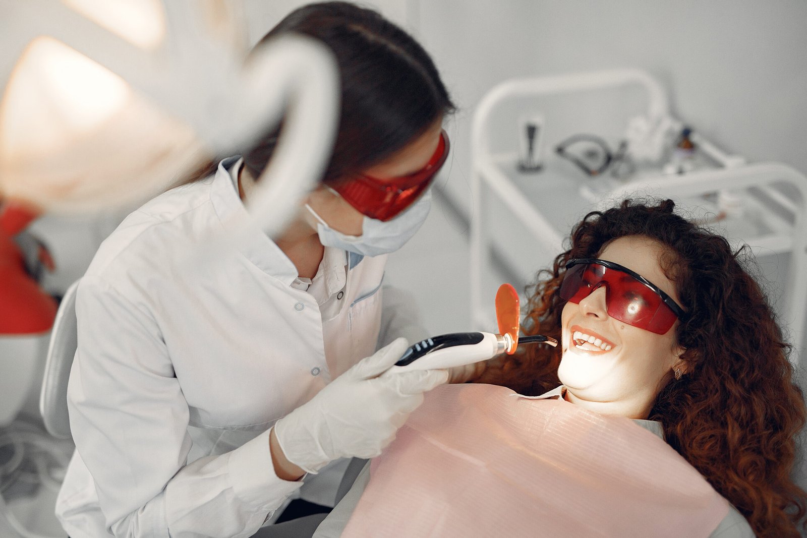 Woman in the dentist's office. Doctor in a uniform.